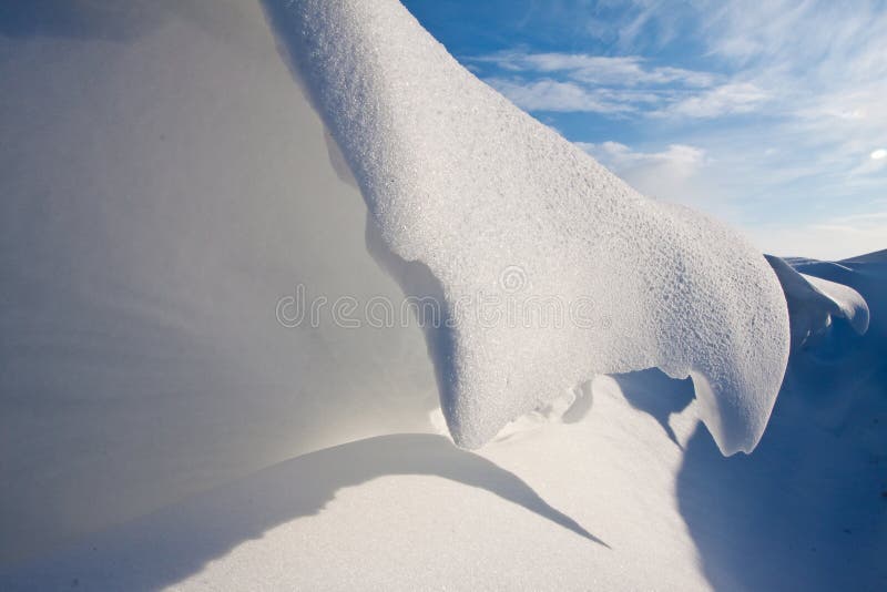 Snow dune in a ditch royalty free stock images