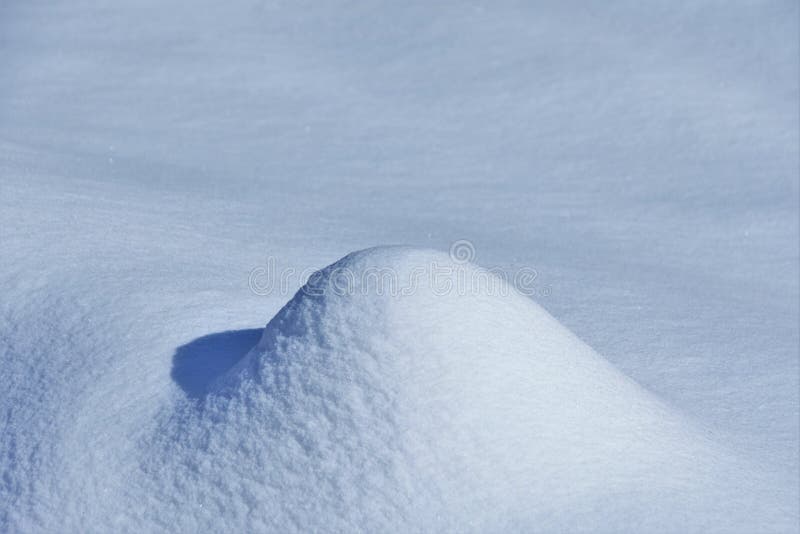 Snow dune in the sun stock photo