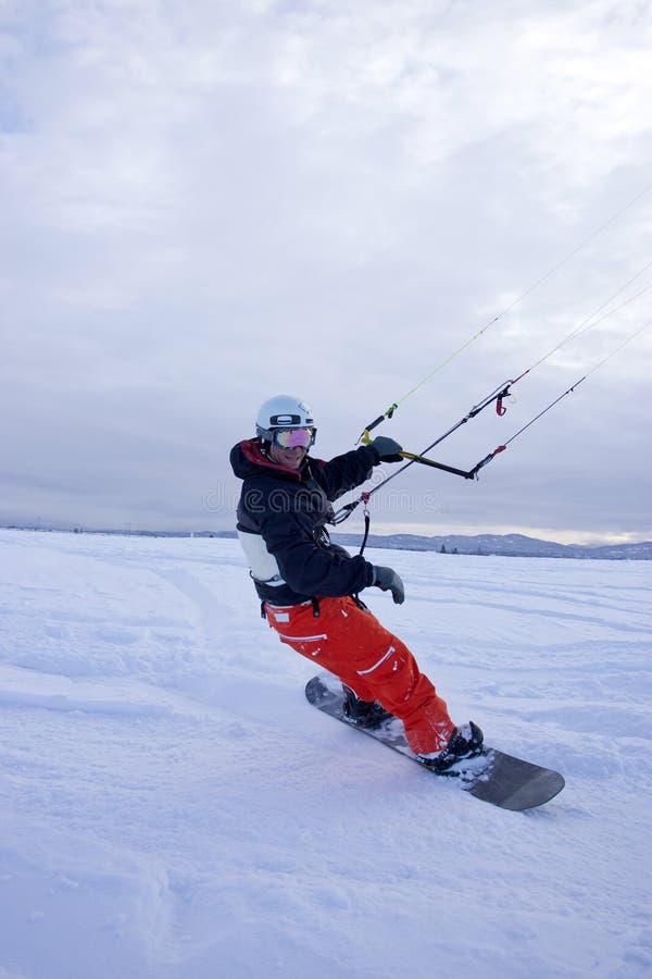 Snow kiting on snowboard. stock photo. Image of gear 17786246