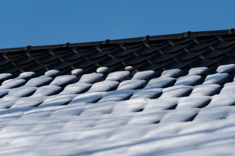 Snow Melting on the Roof. Change of Weather in Winter, White Powder on