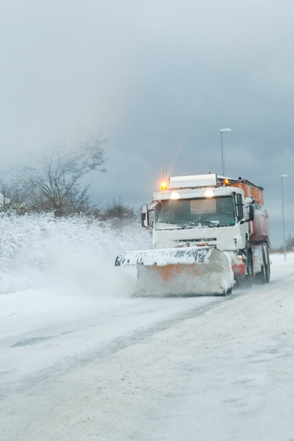 Snow plough clearing heavy snowfall