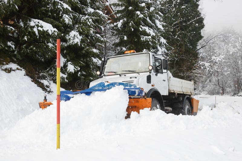 Snow plough making its way through the snow