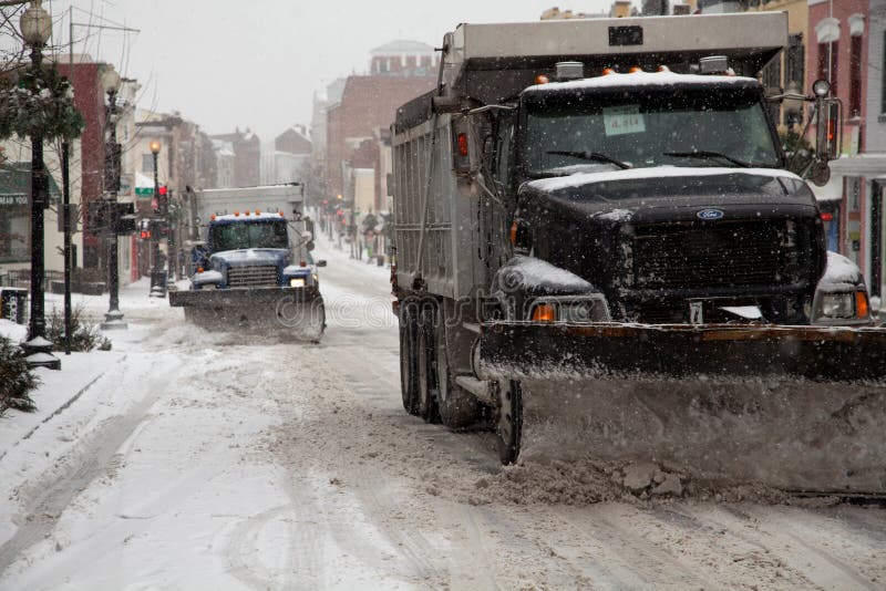 Snow plow trucks royalty free stock photo