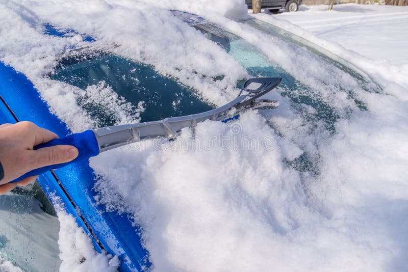 Snow removal from car body stock photo. Image of brush 50356402