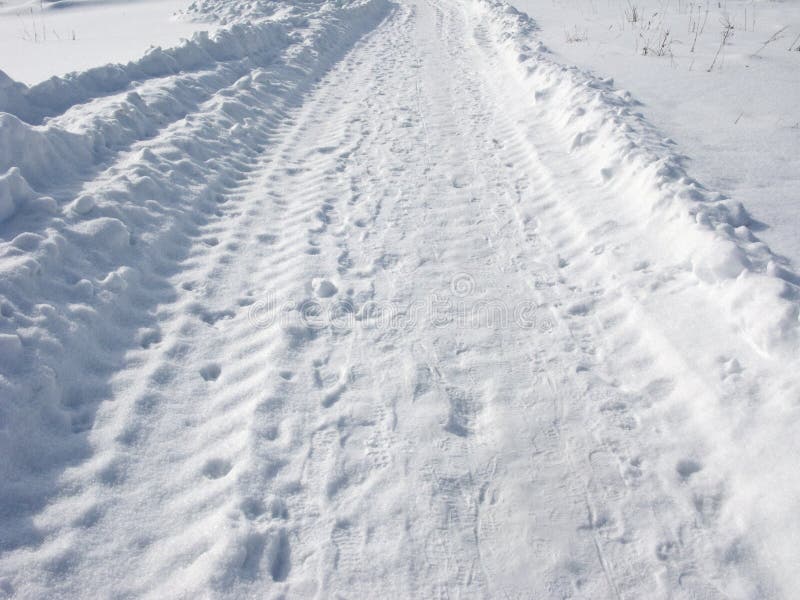 Snow road on winter sunny day