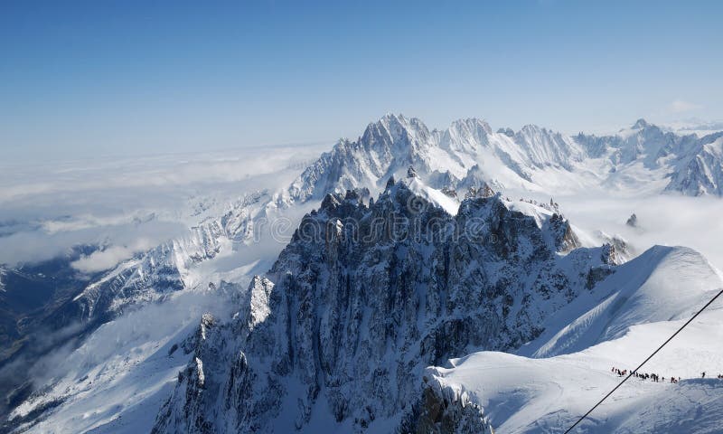 Snow slope with mountain-skiers