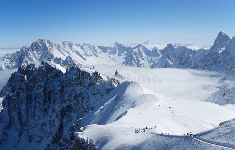 Snow slope with mountain-skiers, the Alps