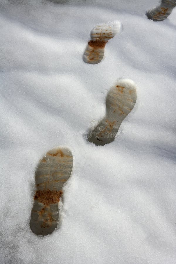 Snow track shoes footprints on winter way. Snow track shoes footprints on winter way