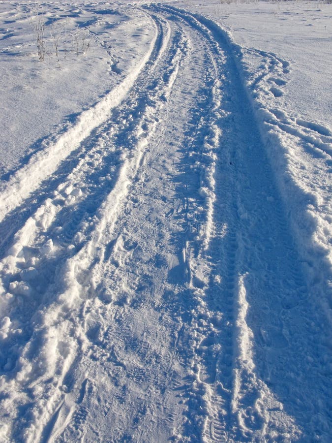 Snow track in winter field