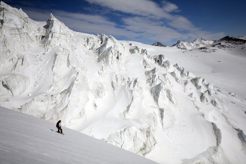 Snowboard freeride in high mountains