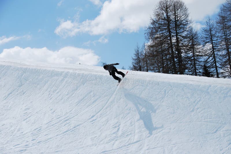 Snowboarder in Half pipe stock image. Image of jumping 9516943