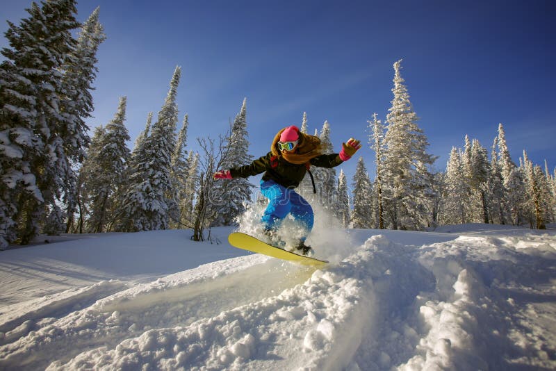 Snowboarder jumping royalty free stock photo