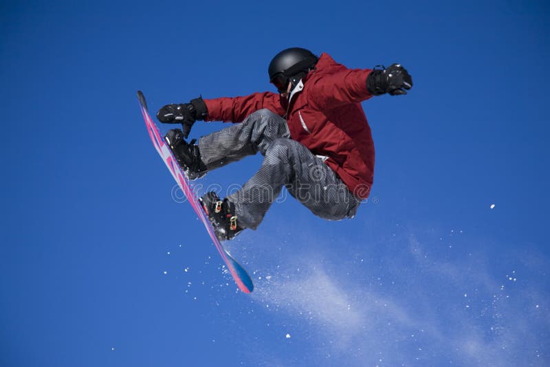 Snowboarder jumping high