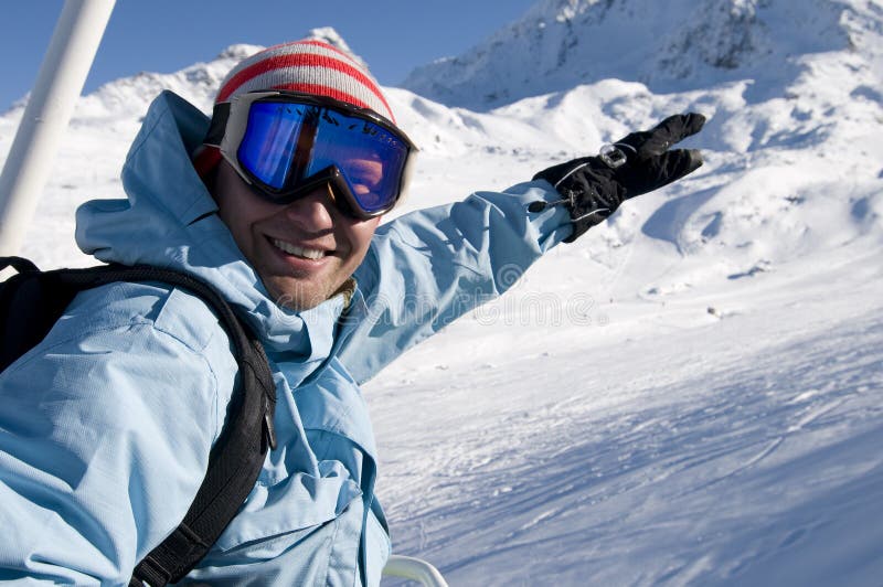 Snowboarder on lift at ski resort