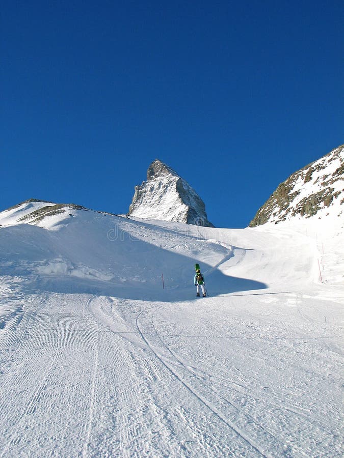 Snowboarder and top of Matterhorn