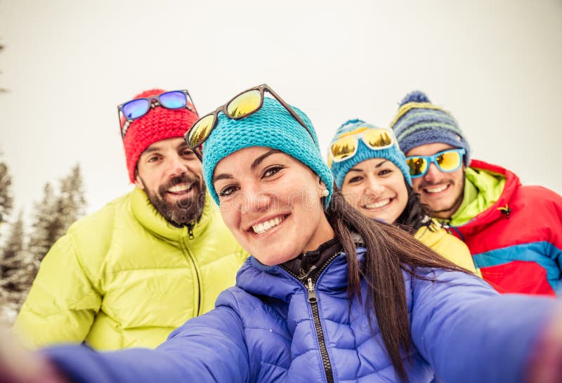 Snowboarders taking selfie