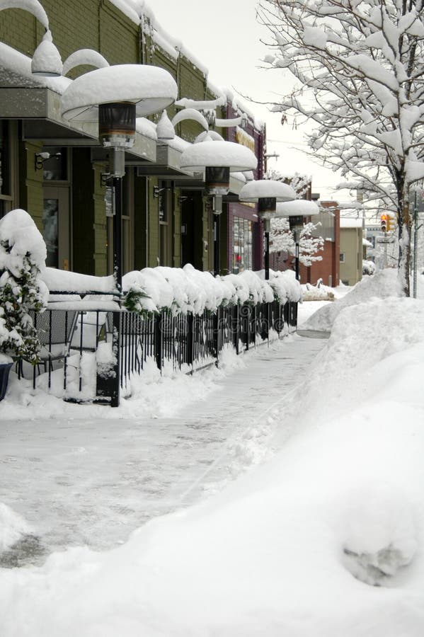 A sidewalk cafe snowed inn after a blizzard