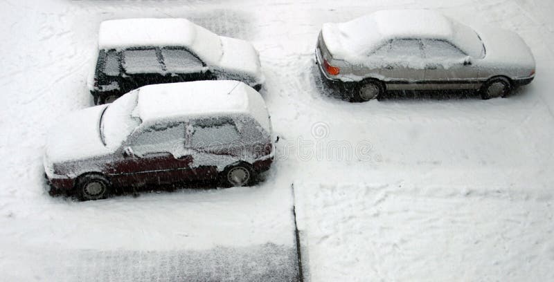 Snow on cars - aerial winter parking view. Snow on cars - aerial winter parking view.
