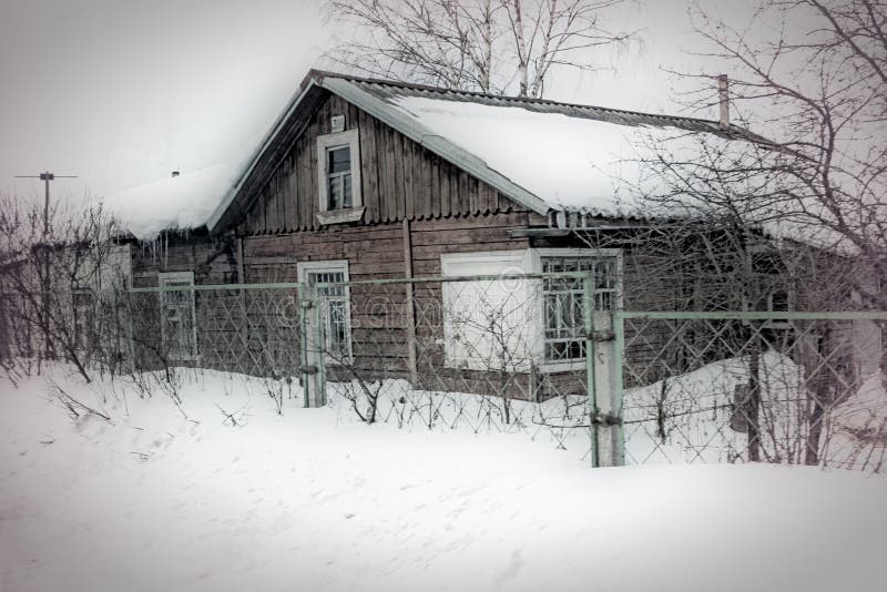 House snowed in a rural area of Russia. House snowed in a rural area of Russia