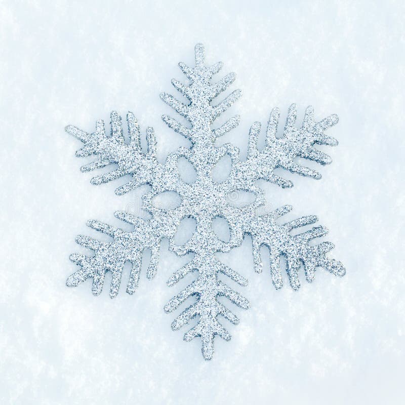 Snowflake in the snow stock images