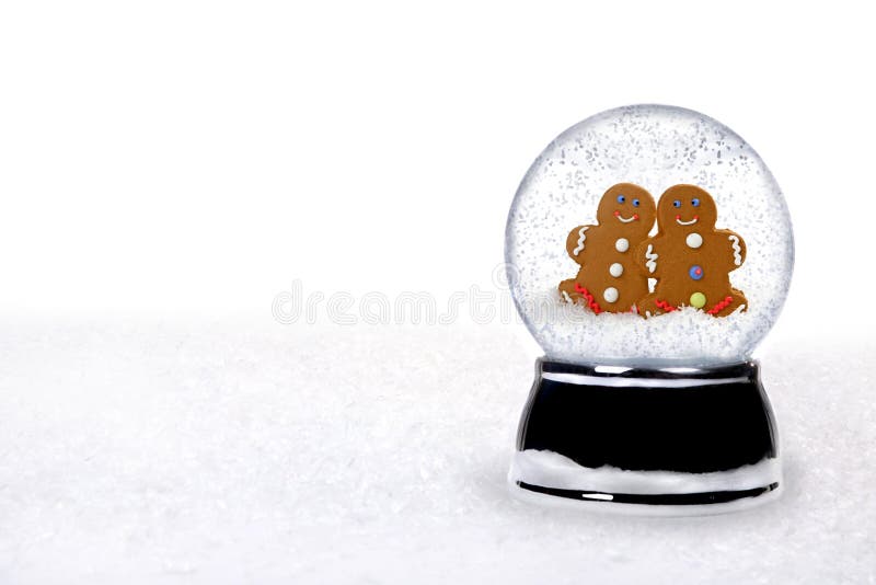 2 Happy Gingerbread People Inside a Snowglobe in Love on Christmas Holiday. 2 Happy Gingerbread People Inside a Snowglobe in Love on Christmas Holiday