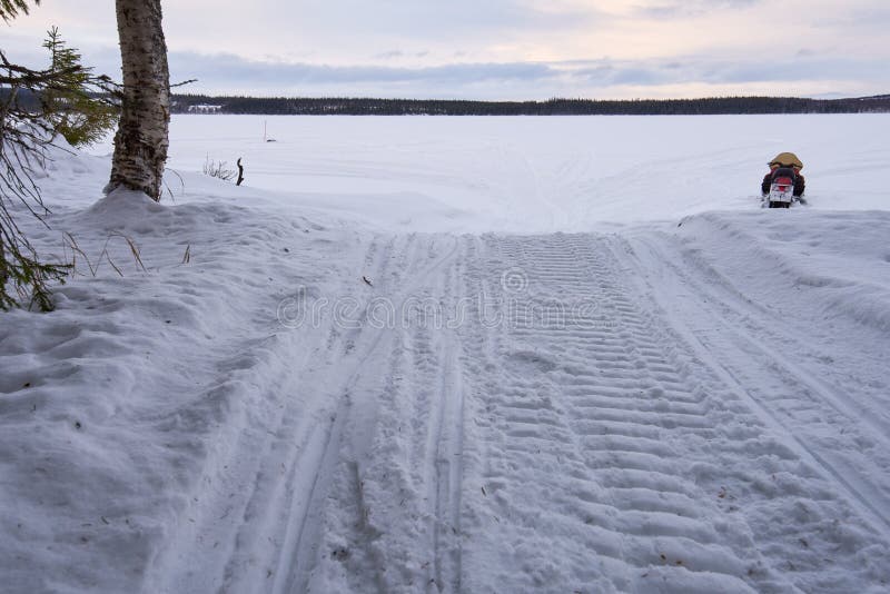 Snowmobile and forest stock photo. Image of track, nature 65936530