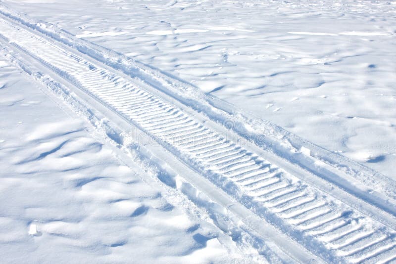 Snowmobile traces on snow.