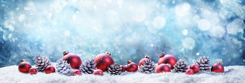 Snowy Christmas Balls And Pinecones royalty free stock photography