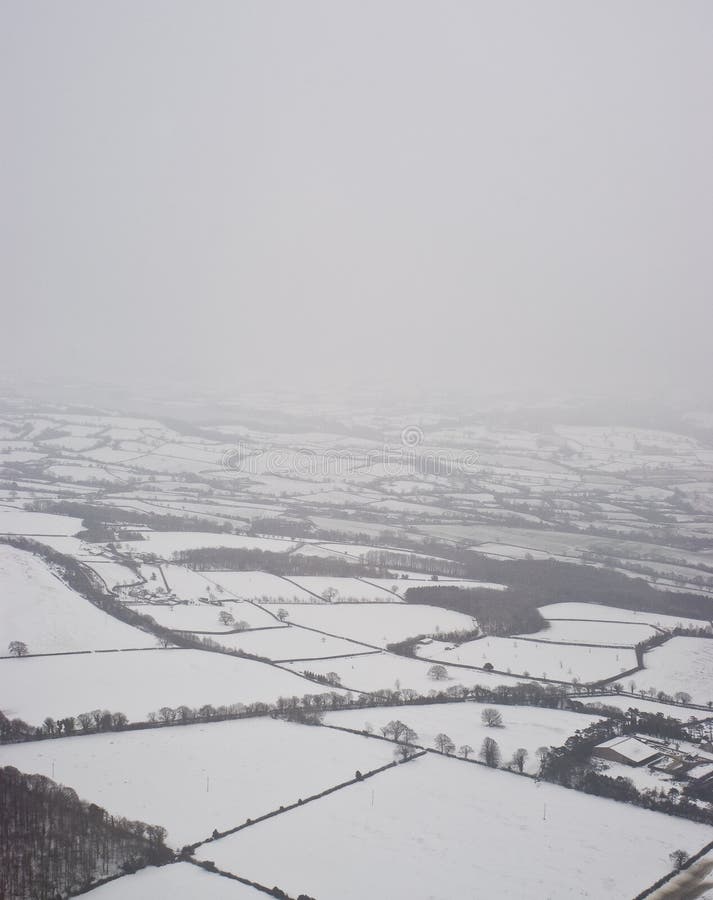 Snowy countryside from a plane