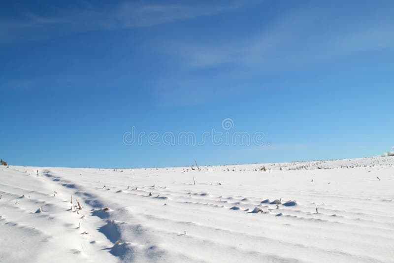 Snowy hill and sky