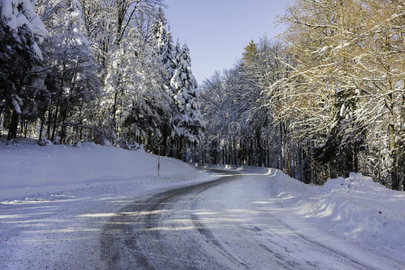 A snowy and icy road in the Vosges mountains France royalty free stock photos A snowy and icy road in the Vosges mountains France royalty free stock photos