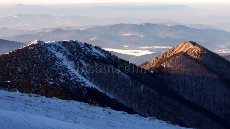 Snowy landscape view of hills from national park Mala Fatra.