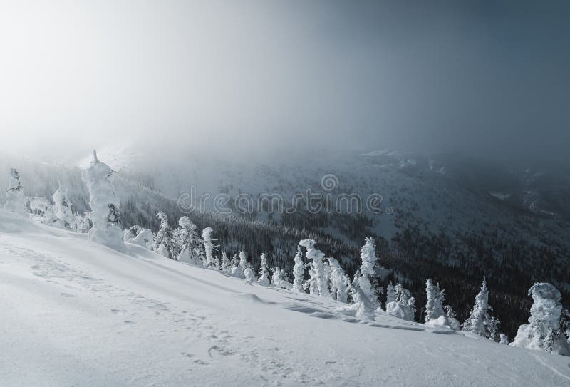 Snowy mountain landscape in cloudy weather near Rossland Range stock photo Snowy mountain landscape in cloudy weather near Rossland Range stock photo
