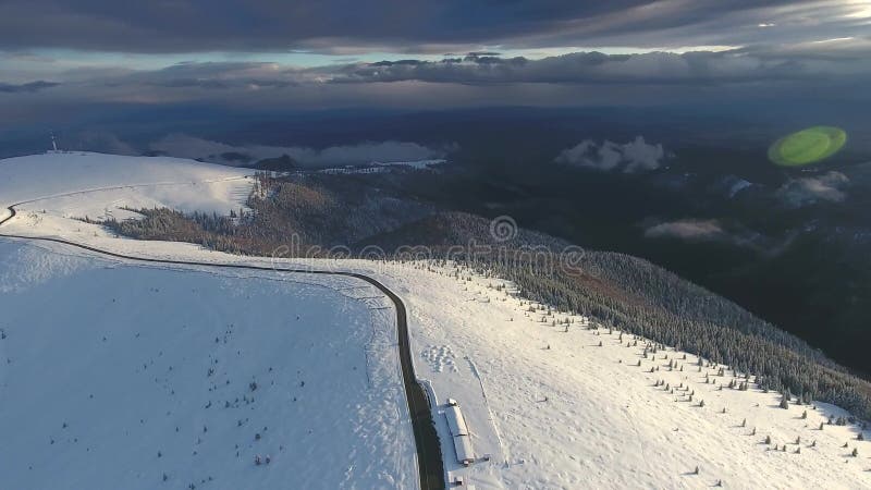 Snowy mountain road in Romania stock footage