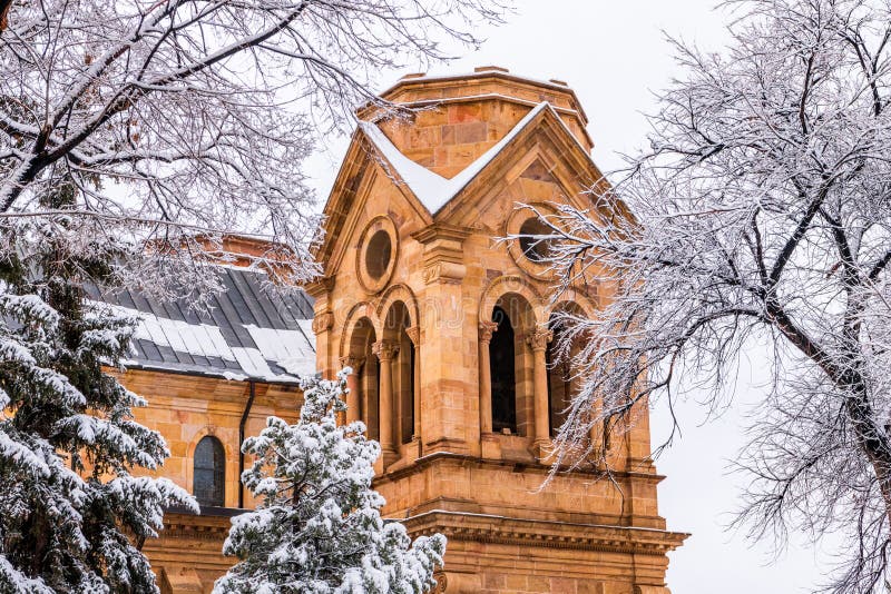 Snowy scene in Santa Fe, church bell tower and snow-covered trees