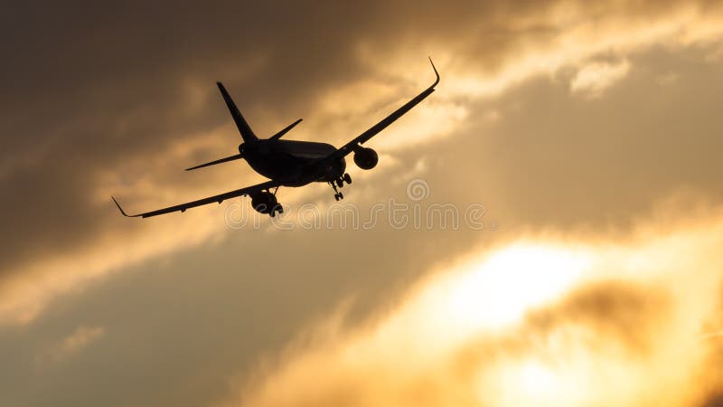 On a snowy winter evening, a jet plane lands at Sheremetyevo Airport in Moscow, Russia