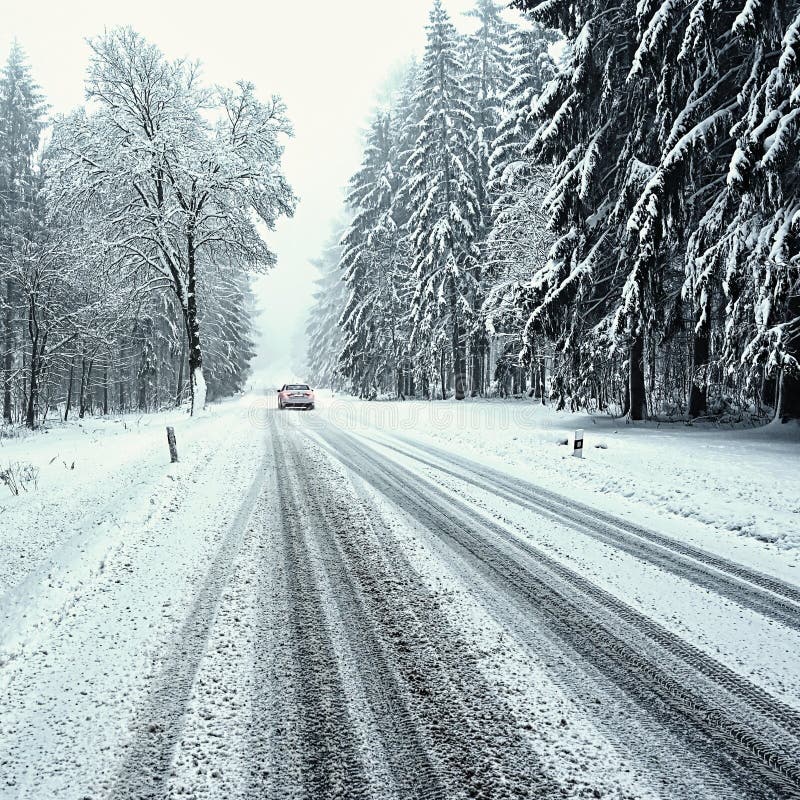 Snowy winter road with car. Dangerous car driving in the mountains in the winter. Concept for transportation, cars and travel royalty free stock photos Snowy winter road with car. Dangerous car driving in the mountains in the winter. Concept for transportation, cars and travel royalty free stock photos
