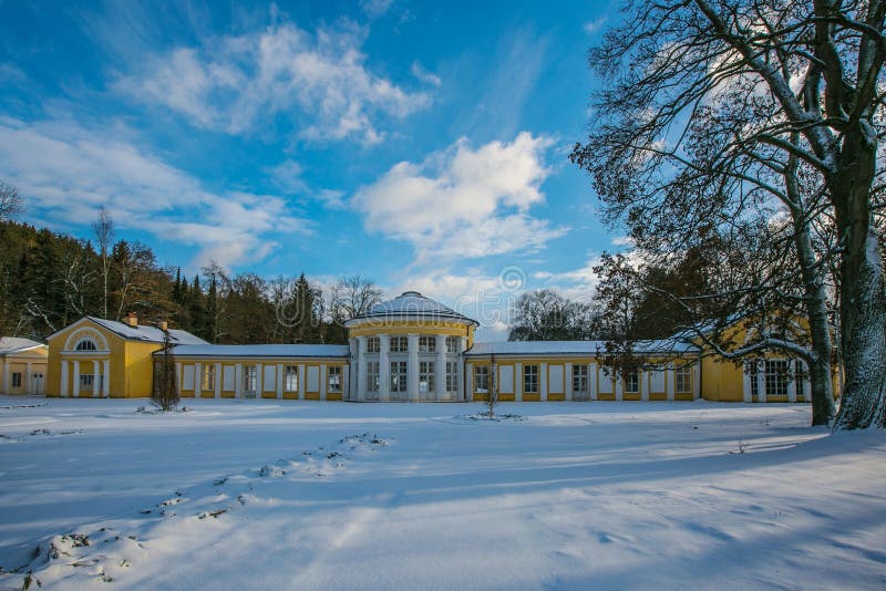 Snowy winter scene of yellow building of Ferdinand colonnade with mineral water at spa town stock photo Snowy winter scene of yellow building of Ferdinand colonnade with mineral water at spa town stock photo