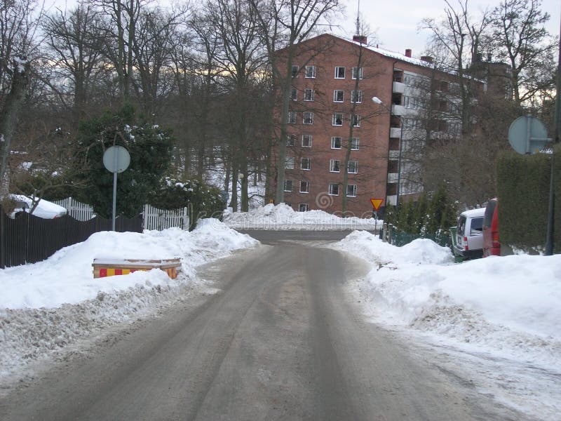 Snow piled up along the roads after the snow plough has cleared them in Karlskrona, Sweden. Snow piled up along the roads after the snow plough has cleared them in Karlskrona, Sweden