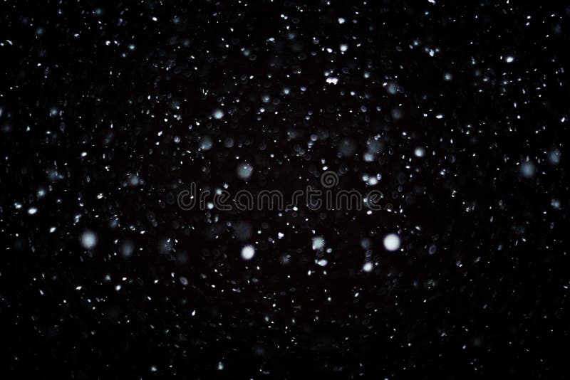 Snöbokehtextur på svart bakgrund