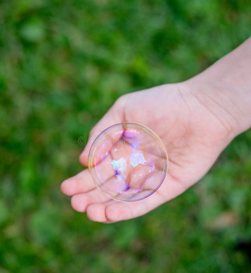 Big soap bubble on green stock image. Image of small - 16736205