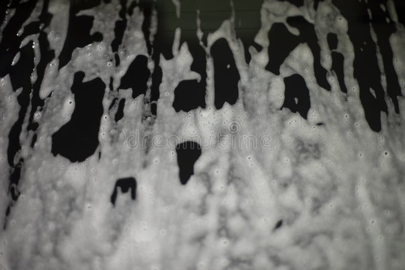 Soap Foam on Dark Surface. Rinsing Dirt Off Glass Stock Photo Image