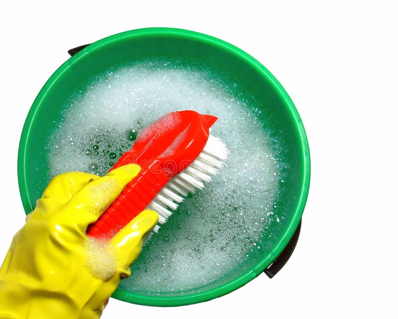 Close-up of a bucketful of soapy water with a rubber-gloved hand holding a scrubbing brush. Isolated over pure white. Close-up of a bucketful of soapy water with a rubber-gloved hand holding a scrubbing brush. Isolated over pure white.