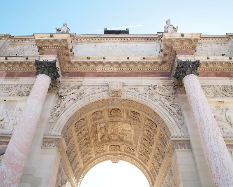 Under of Arc de Triomphe du Carrousel with blue sky in Paris, France. In front of Louvre museum. Under of Arc de Triomphe du Carrousel with blue sky in Paris, France. In front of Louvre museum.