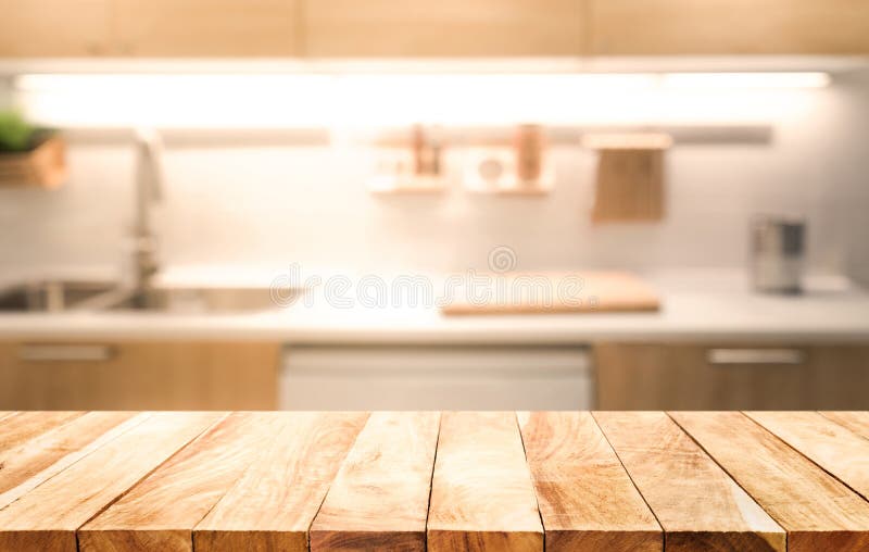 Sobremesa de madera en fondo del sitio de la cocina de la falta de definición que cocina concepto