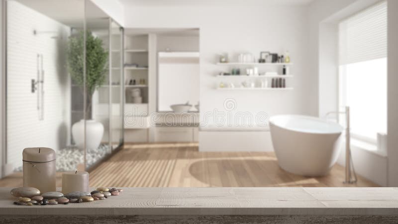 Sobremesa o estante de madera del vintage con las velas y guijarros, humor del zen, sobre cuarto de baño minimalista borroso con imagen de archivo libre de regalías Sobremesa o estante de madera del vintage con las velas y guijarros, humor del zen, sobre cuarto de baño minimalista borroso con imagen de archivo libre de regalías