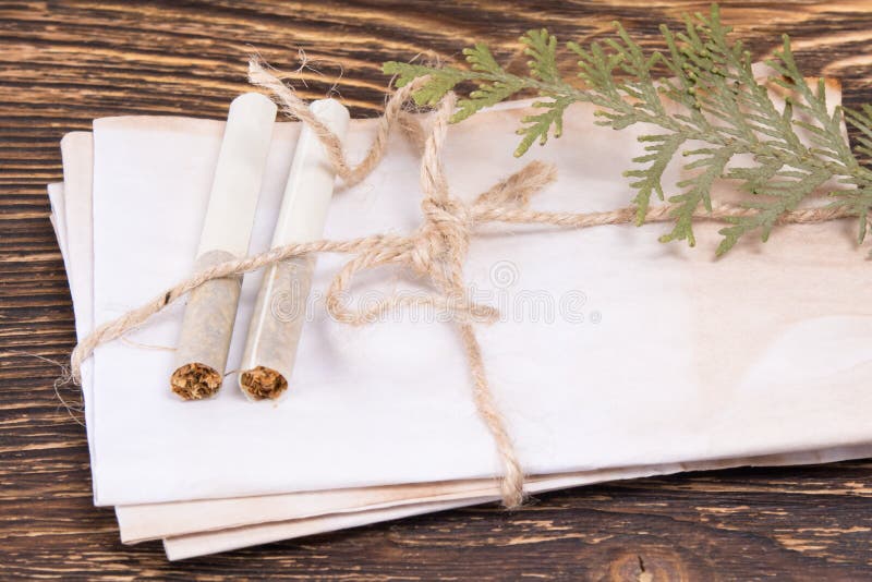 Old envelopes on the table with cigarettes. Old envelopes on the table with cigarettes