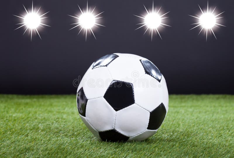 Soccer Ball on Green Pitch stock image. Image of championship 35310941