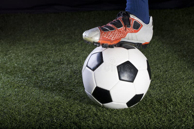 Kicking the Soccer Ball on a Grass Field at Night Stock Photo Image