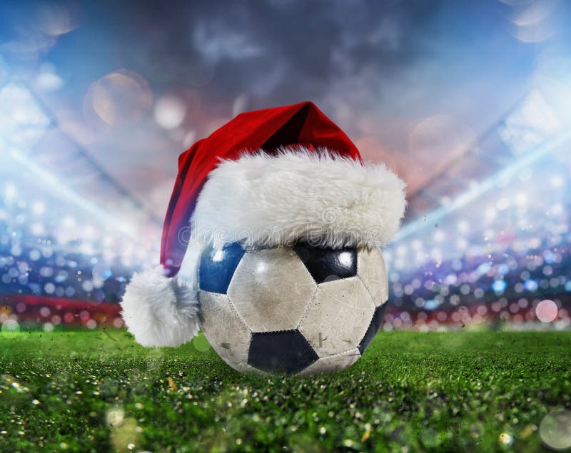 Soccer Ball in a Stadium with the Christmas Hat Stock Photo Image of